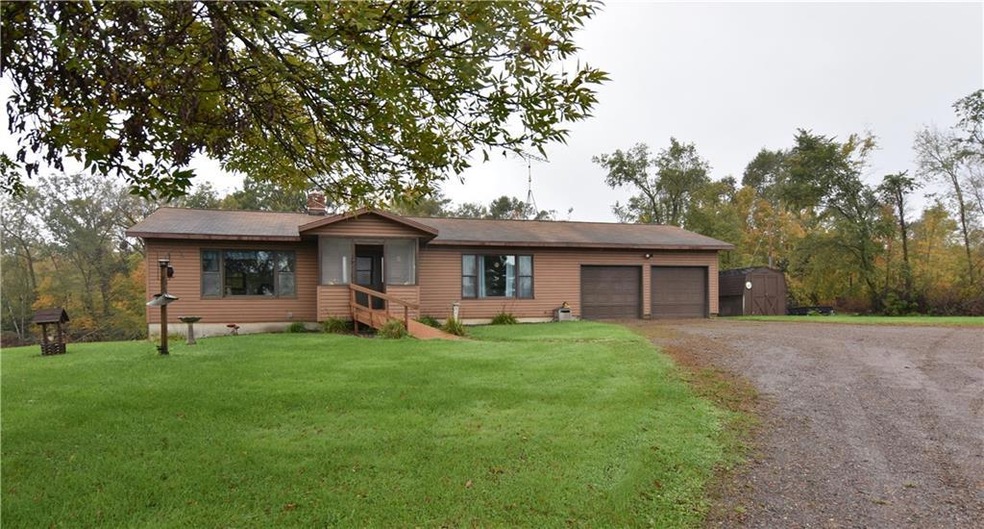 Country home with attached two car garage