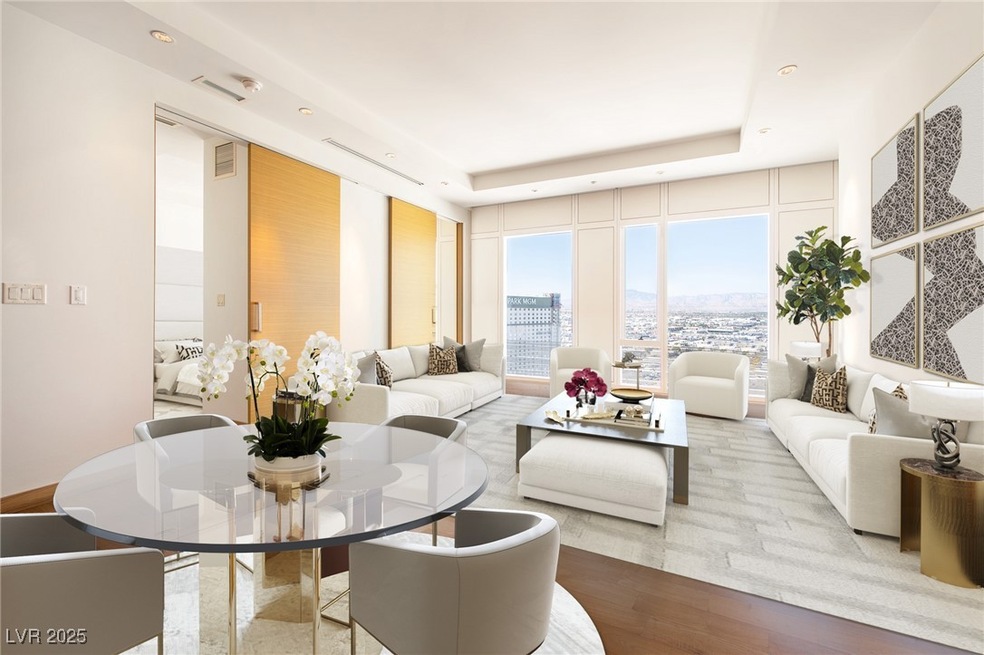 Living area featuring expansive windows, a raised