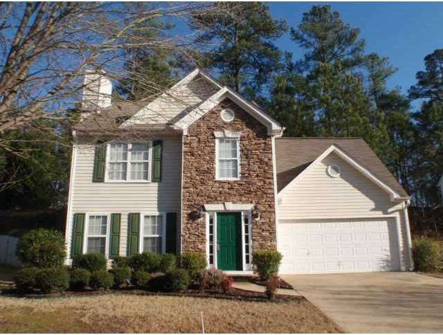 Exterior Front. Stone front & low maintenance viny