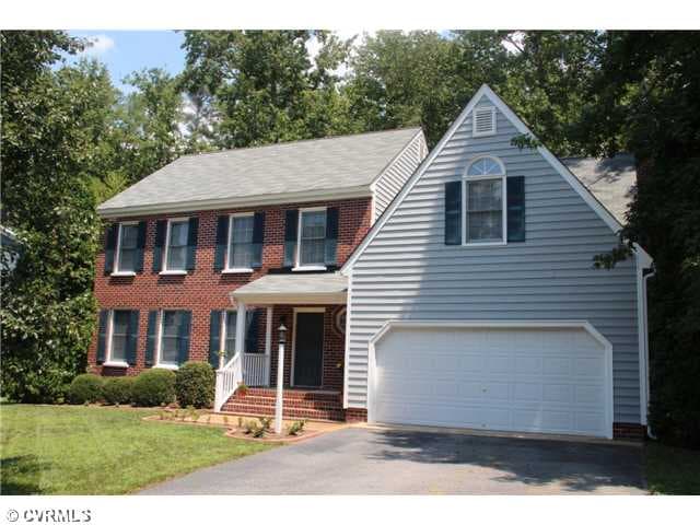 Exterior Front - Vinyl sided, brick front, built o