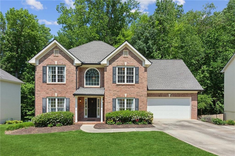 This brick-front traditional has SO much space for everyone - and everything!