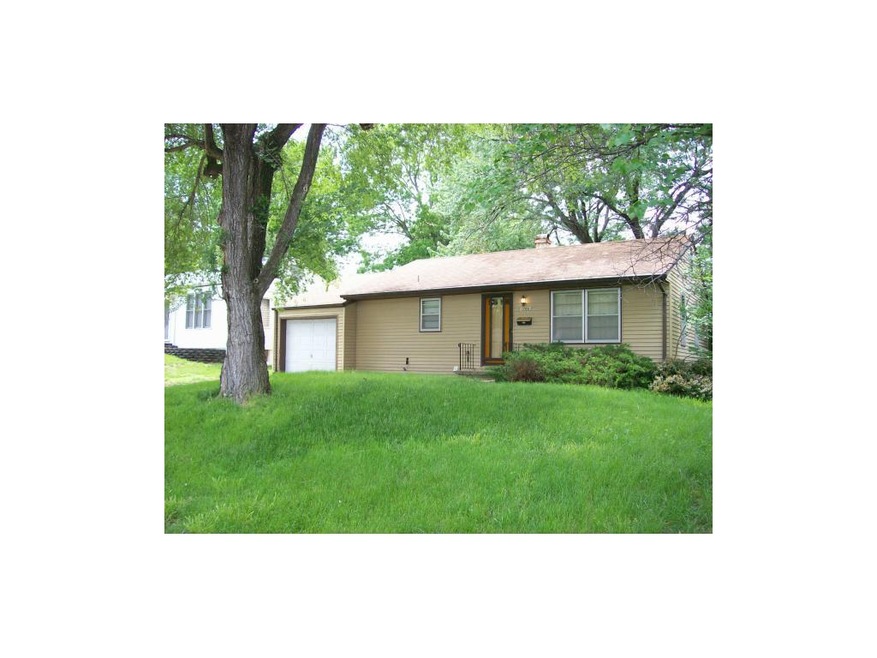 Front View showing plush yard and big trees