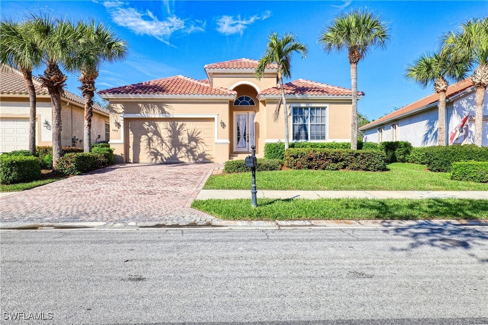 Mediterranean / spanish-style home with a garage
