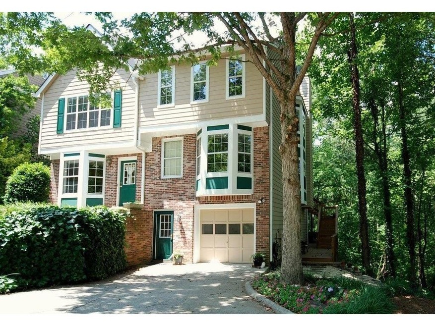 End unit townhome with large lot & creek view