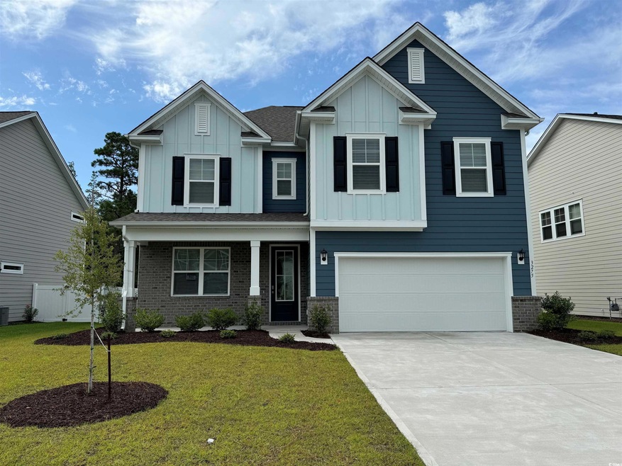 Craftsman-style home featuring a garage and a fron