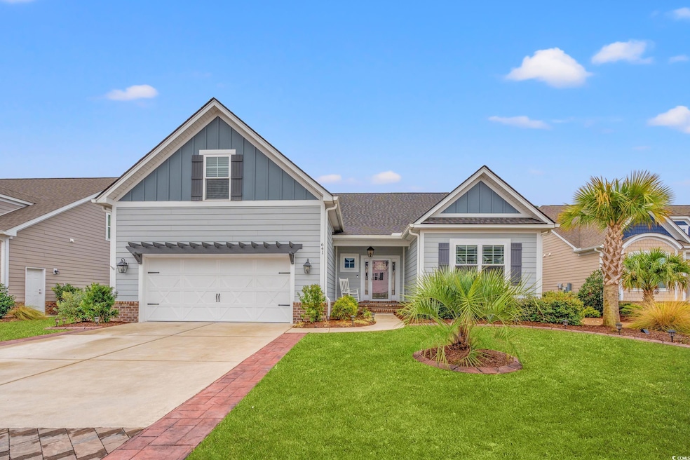 View of front of property featuring a garage and a