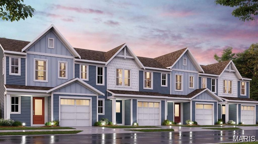 View of front of house with board and batten siding, an attached garage, a shingled roof, and driveway
