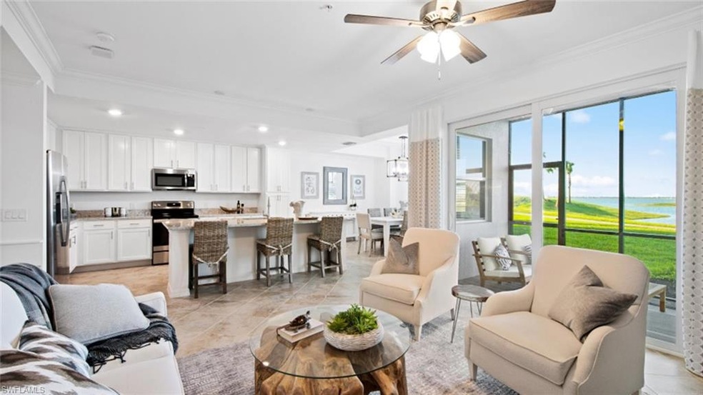 Living room featuring ceiling fan with notable cha