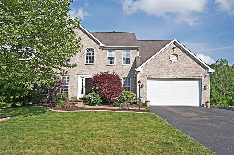 This home is a 10! Beautiful landscaping welcomes 