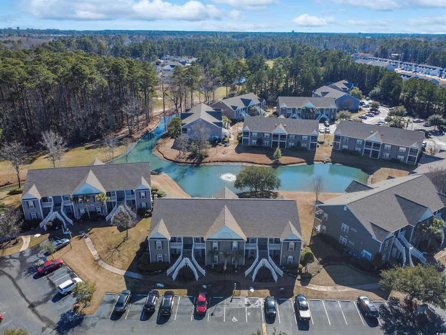 Drone / aerial view featuring a water view and a v