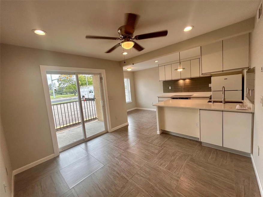 Kitchen featuring freestanding refrigerator, a ce