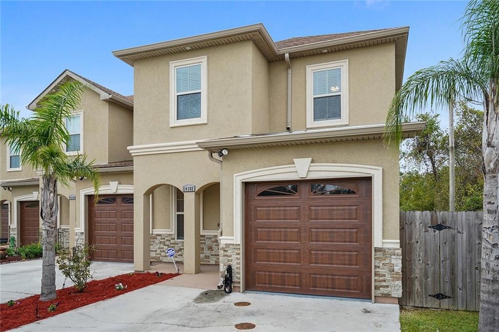 End Unit with side gate for rear yard access.