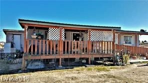 Rear view of house featuring a deck