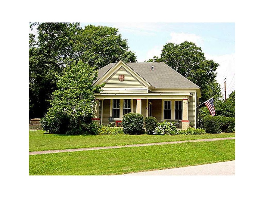 Exterior Front. Craftsman Cottage with large rooms and high ceilings. Corner location walking distance to shopping and dining.