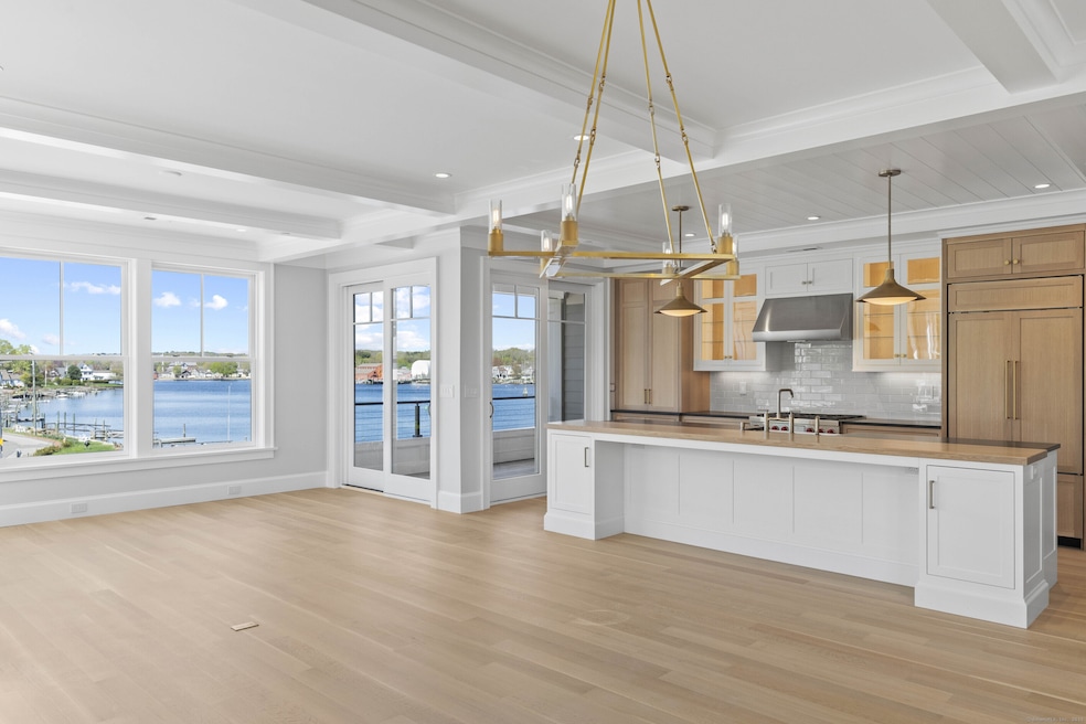 Open floor plan with panoramic views of Mystic Riv