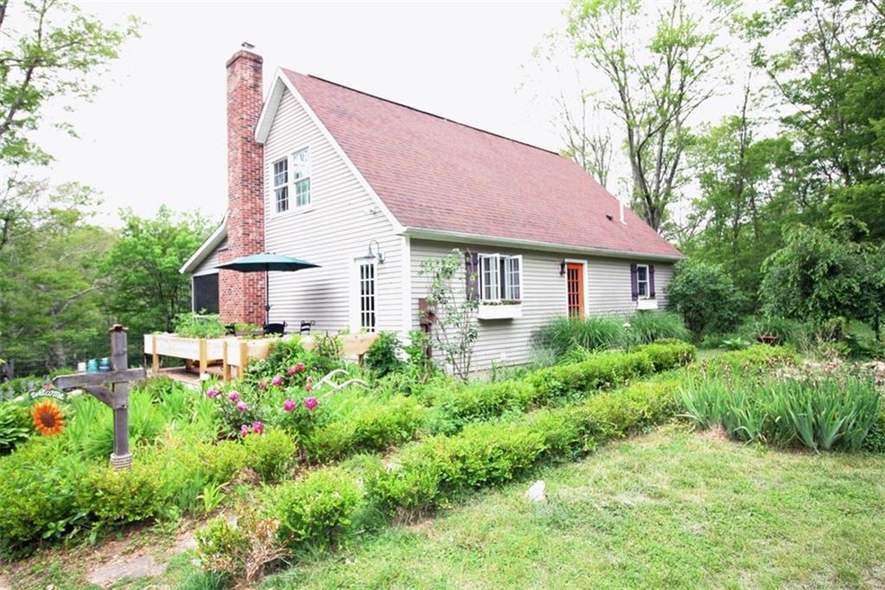 Front View with deck and garden path