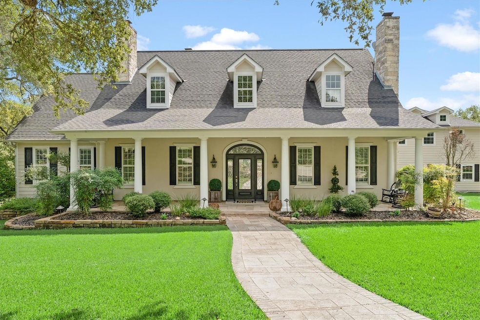 View of front of house featuring a chimney, cover