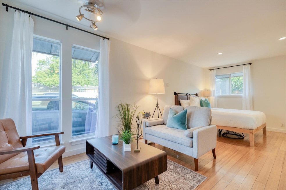 Living room featuring light wood-style flooring a