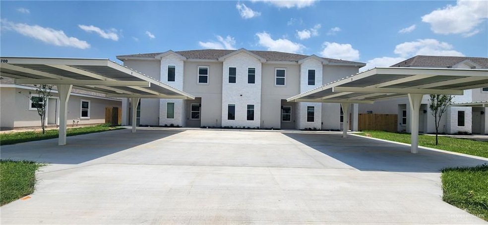 View of front of property with a carport