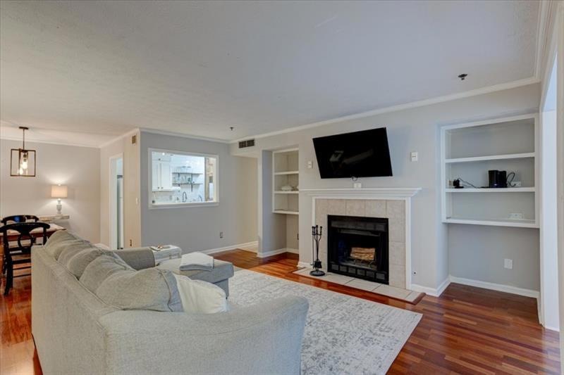 Welcoming open concept living space with hardwood 