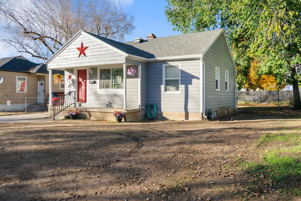 Bungalow with a chimney, a shingled roof, and a porch
