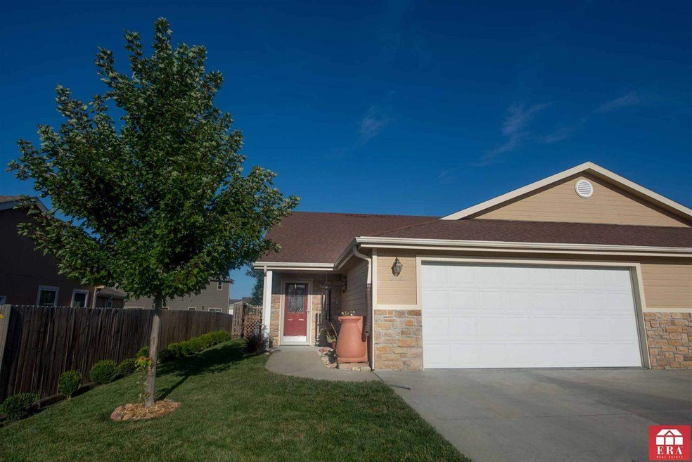 Front of home. Landscaped lawn, fully insulated ga