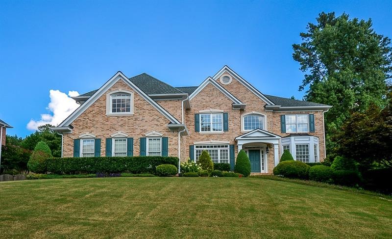 4 sided brick home with beautiful landscape and pr