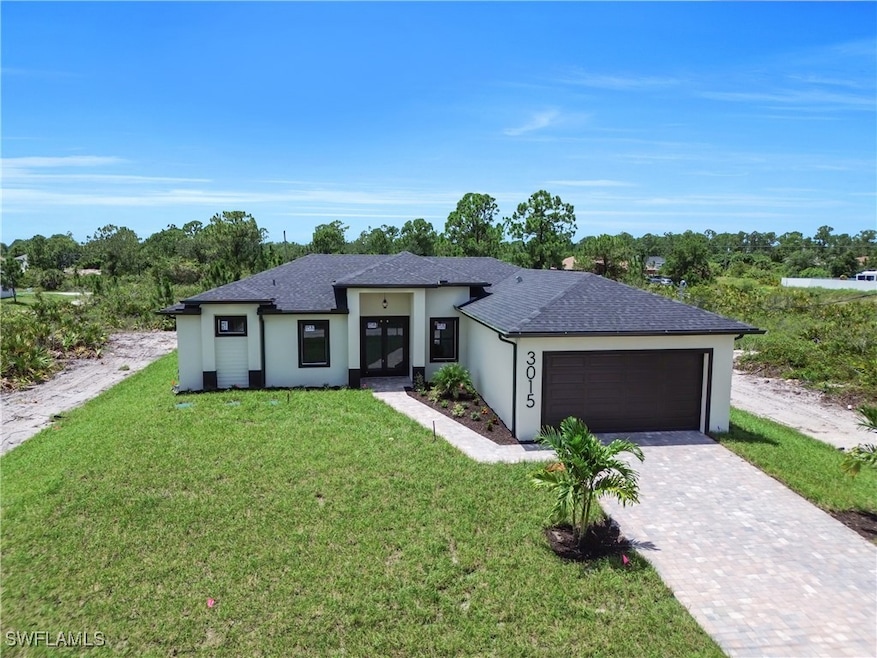 Prairie-style home with an attached garage, stucco