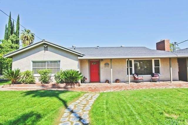 Stone entry path leads to beautiful brick front po
