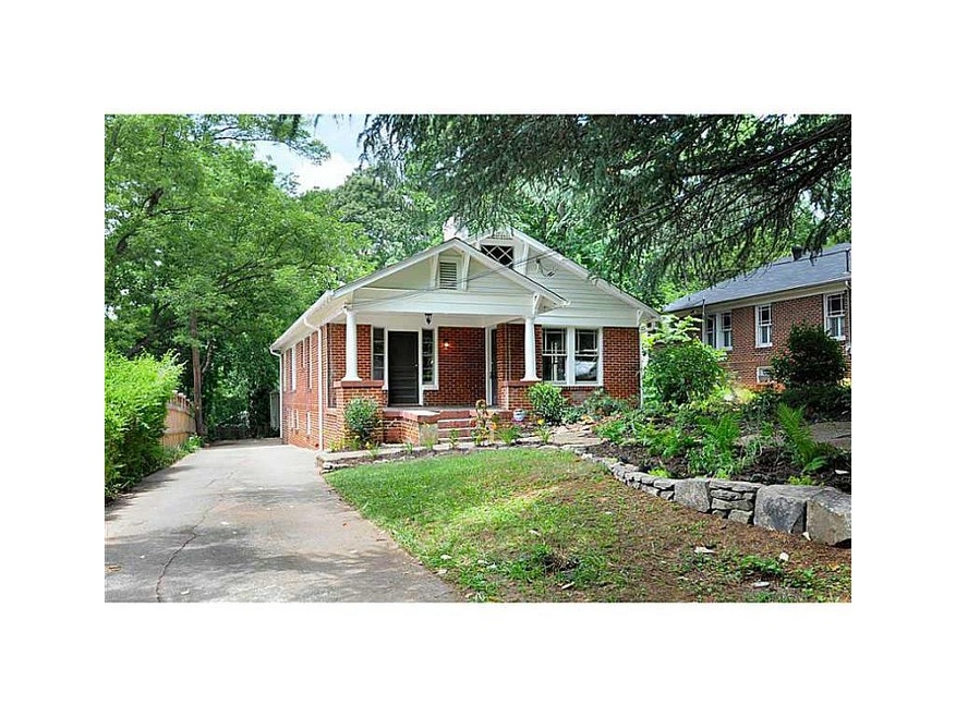 Exterior Front. This brick Craftsman lives large. 