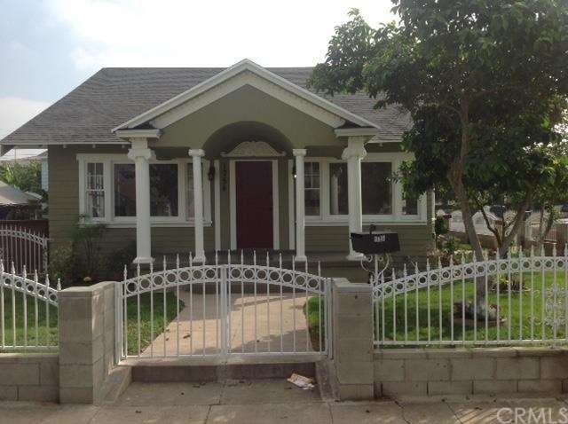 front view off Linden Ave with Red door and porch.
