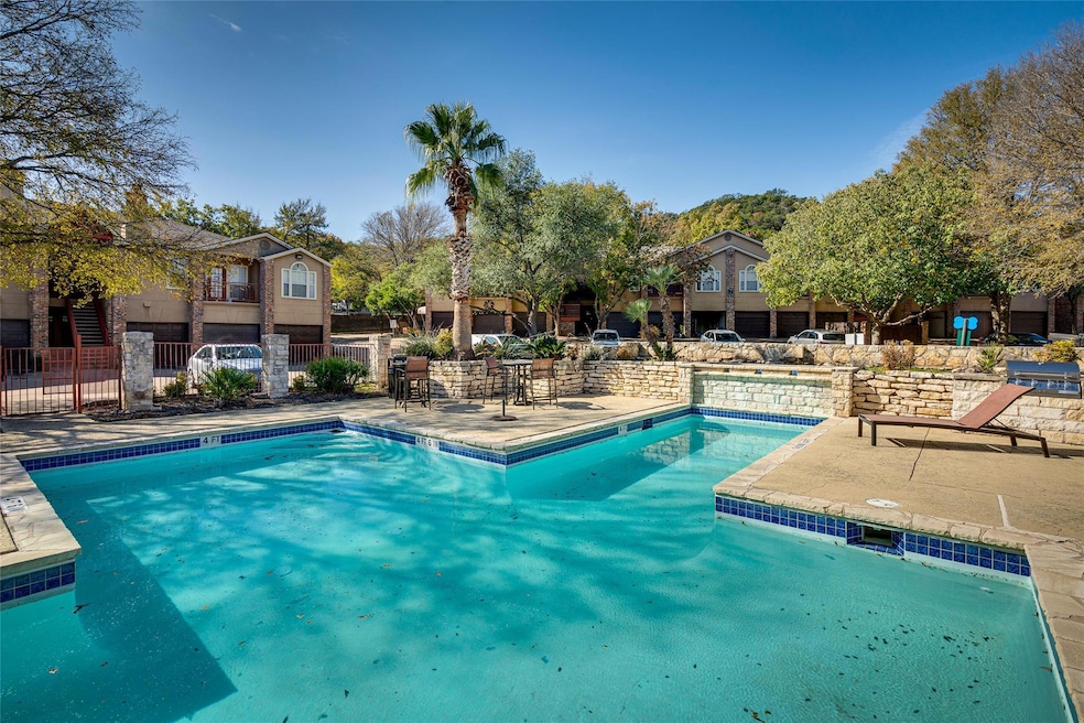 Community pool featuring fence