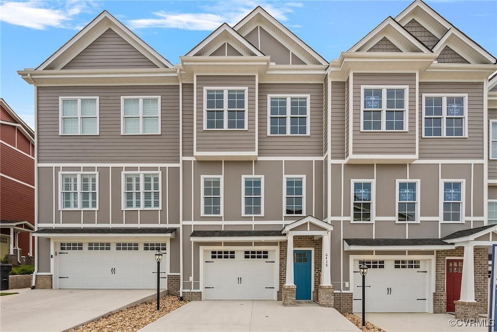 Townhome / multi-family property with a garage