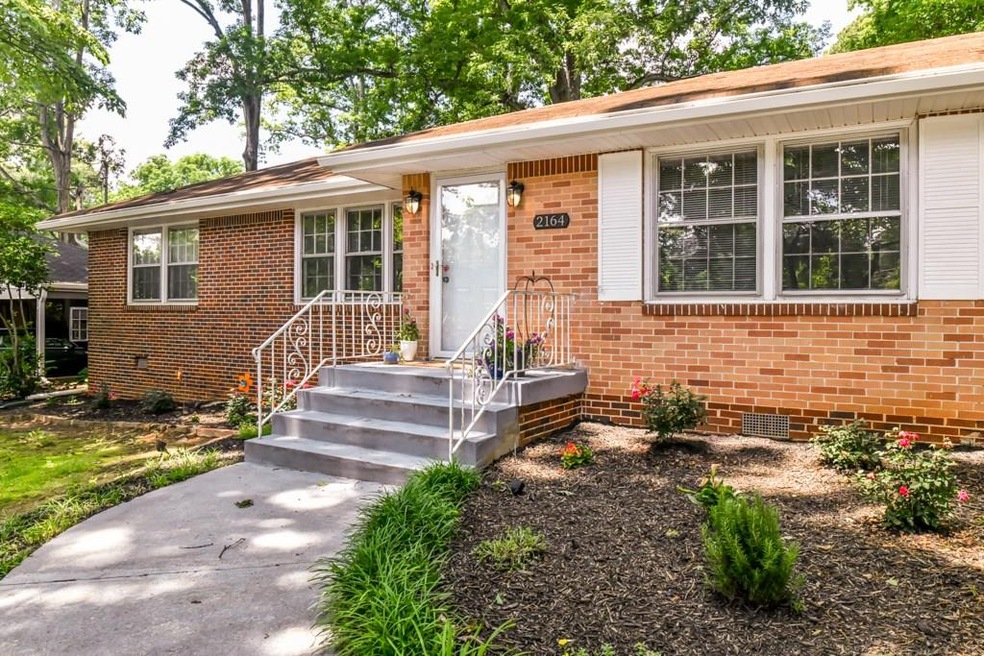 Beautiful brick ranch is set back from the road fo
