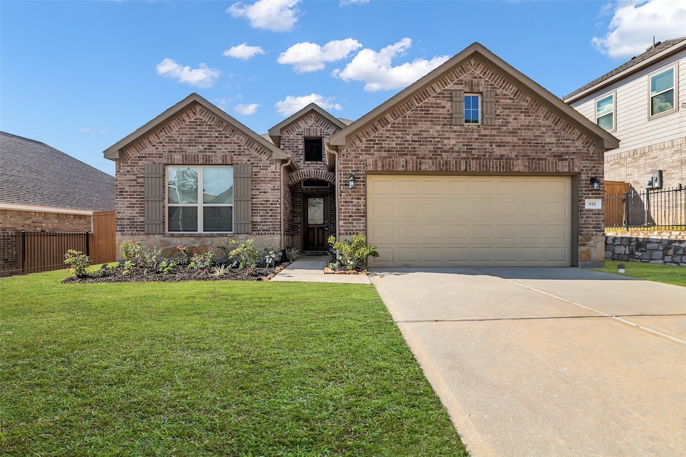 Welcome to 935 Golden Willow Lane. This home features a well-maintained front lawn and excellent curb appeal.