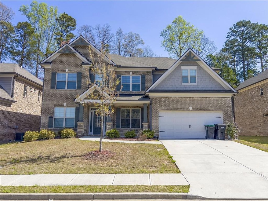 Craftsman-style house with central AC unit, a fron