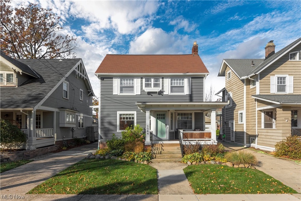 View of front of property with a rebuilt front porch and newer exterior paint (2019)