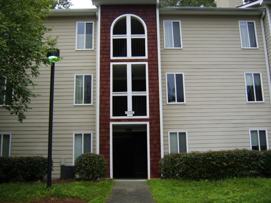 Top unit on the back side of building.
