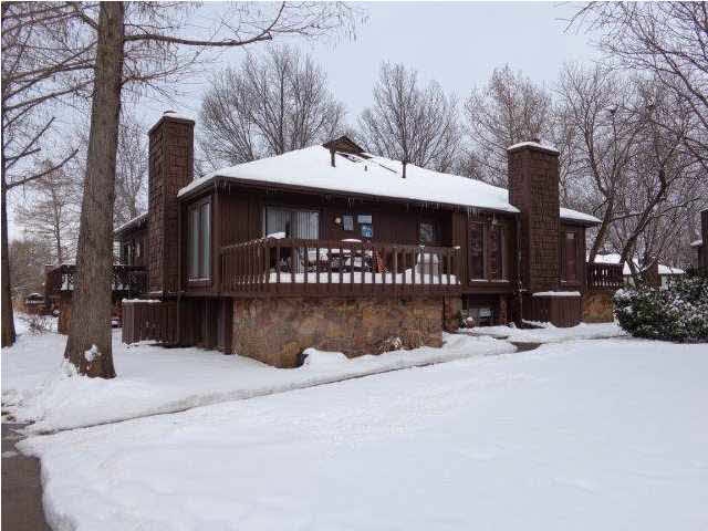 TREE HOUSE CONDOMINIUM BLANKETED IN SNOW.