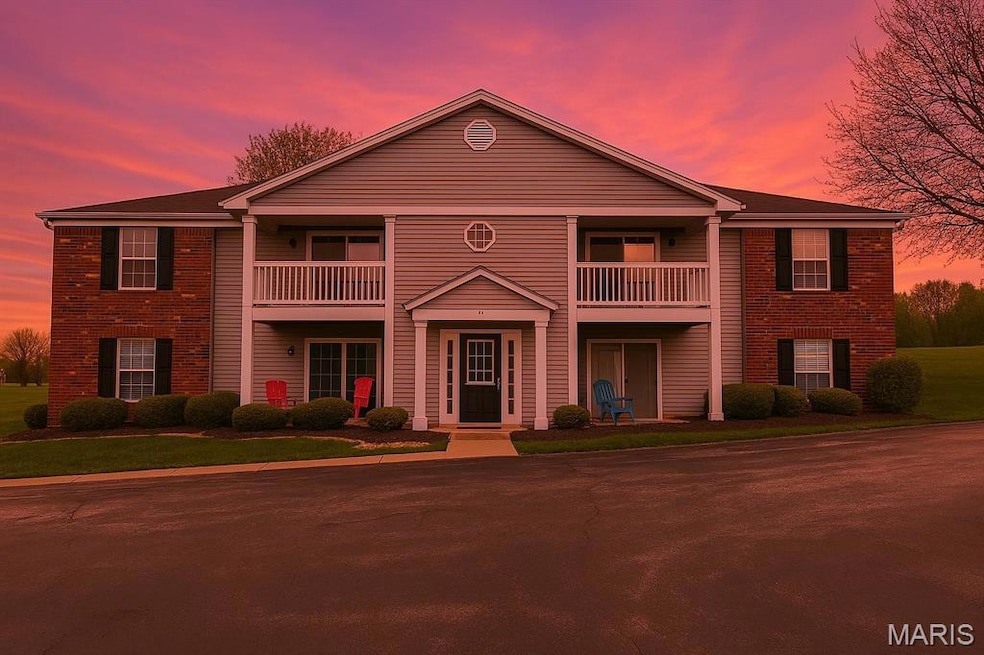 View of front of house with brick siding and a balcony. AI generated background.