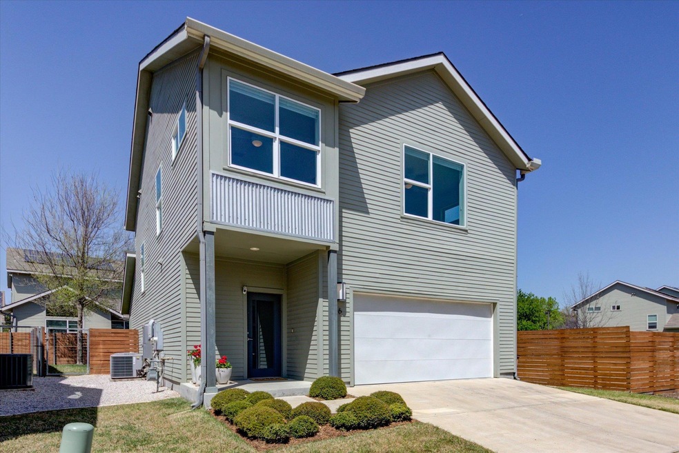 View of front facade featuring cooling unit, conc