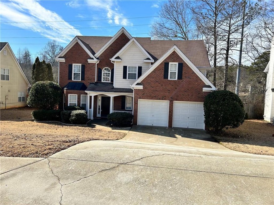 View of front of property featuring a garage
