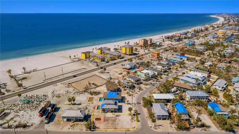 A block from the beach is this lot with pool ready