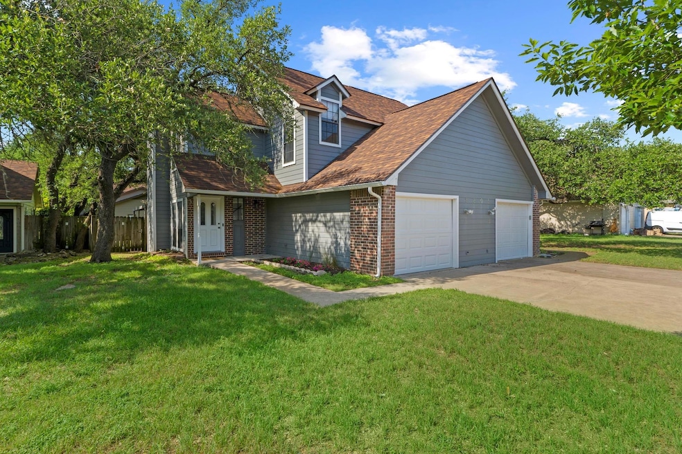 Traditional home featuring an attached garage, br