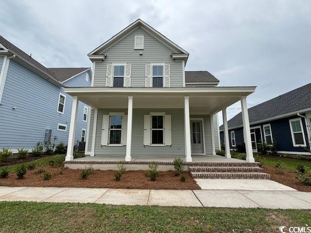 Farmhouse-style home with a porch