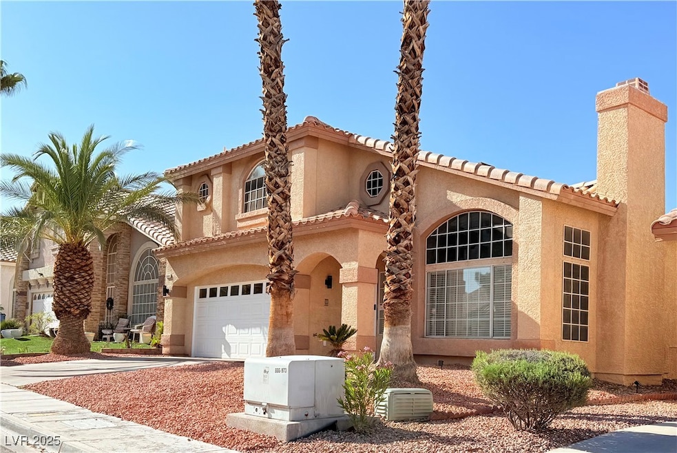 Mediterranean / spanish-style home with a chimney,