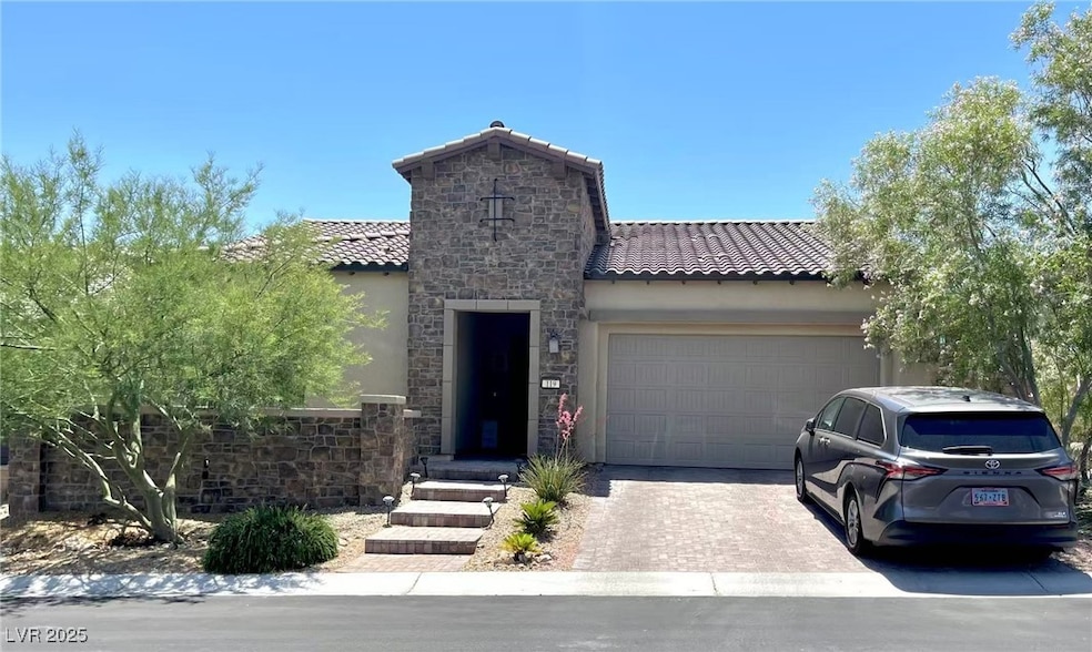 Mediterranean / spanish-style home featuring a til