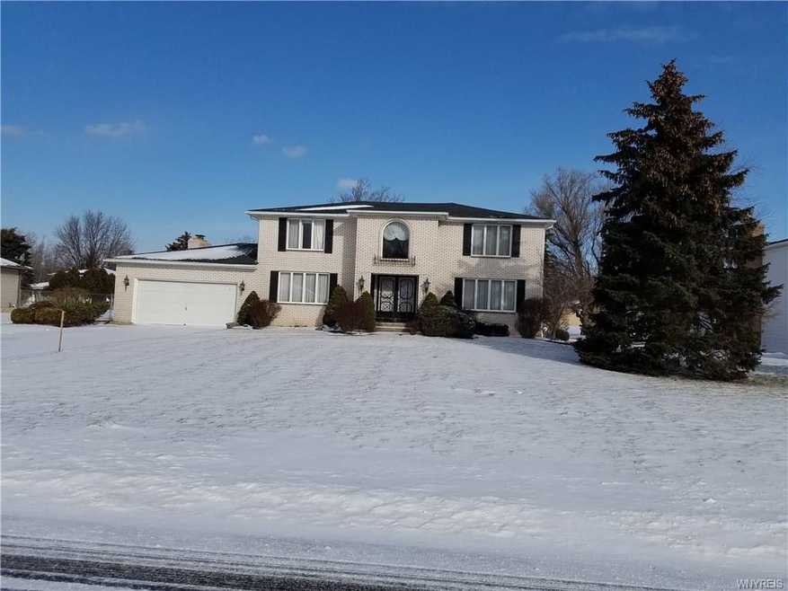 Front exterior all brick home on 1/2 acre lot.