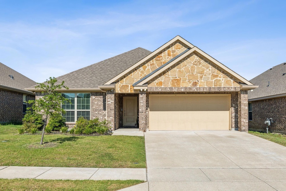 Stone accents set this home apart and what an adorable, unique front facade!