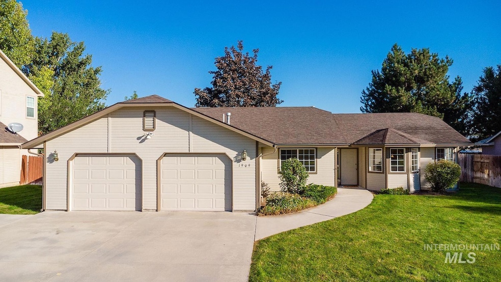 Ranch-style house with concrete driveway, an attached garage, and a shingled roof
